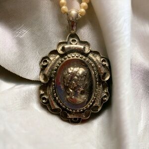 Collectible Cameo necklace on a Pearl chain